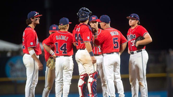 Ole Miss baseball coach Mike Bianco heads to the mound to change pitchers again after Mississippi