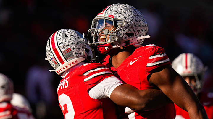 Ohio State Buckeyes star Caleb Downs celebrates with linebacker Sonny Styles after sacking Rutgers QB Athan Kaliakmanis