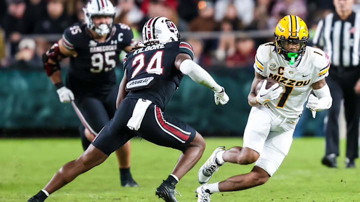 Nov 16, 2024; Columbia, South Carolina, USA; Missouri Tigers wide receiver Theo Wease Jr. (1) runs after a reception against South Carolina Gamecocks defensive back Jalon Kilgore (24) in the second half at Williams-Brice Stadium. Mandatory Credit: Jeff Blake-Imagn Images