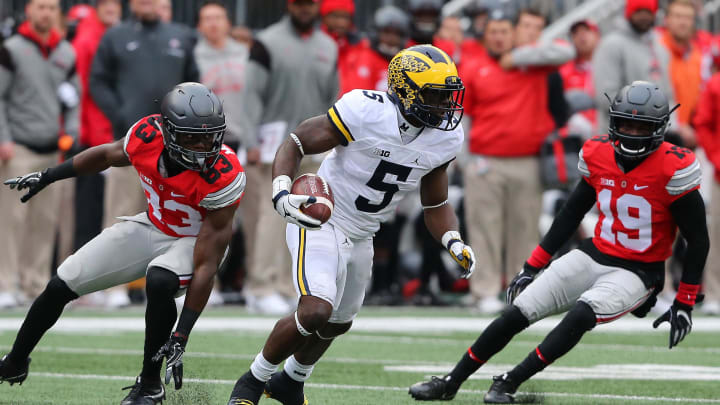 Nov 26, 2016; Columbus, OH, USA; Michigan Wolverines linebacker Jabrill Peppers (5) runs as Ohio State Buckeyes defenders Terry McLaurin (83) and Eric Glover-Williams (19) pursue during the second quarter at Ohio Stadium. Michigan Wolverines lead at half 10-7.  Mandatory Credit: Joe Maiorana-USA TODAY Sports