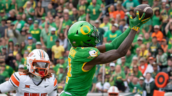 Oregon wide receiver Malik Benson hauls in a touchdown reception under coverage from Oklahoma State safety Dylan Smith as the Oregon Ducks host the Oklahoma State Cowboys on Sept. 6, 2025, at Autzen Stadium in Eugene, Oregon.