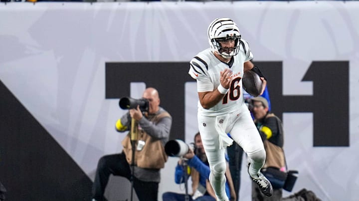 Flacco breaks free into the open field. 