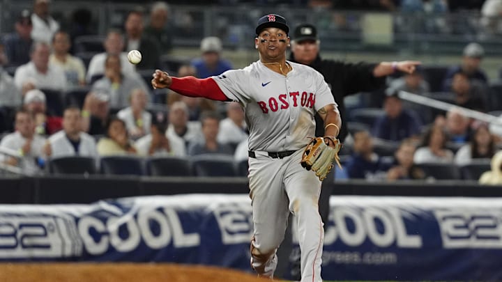 Boston Red Sox third baseman Rafael Devers throws the ball from third base. 