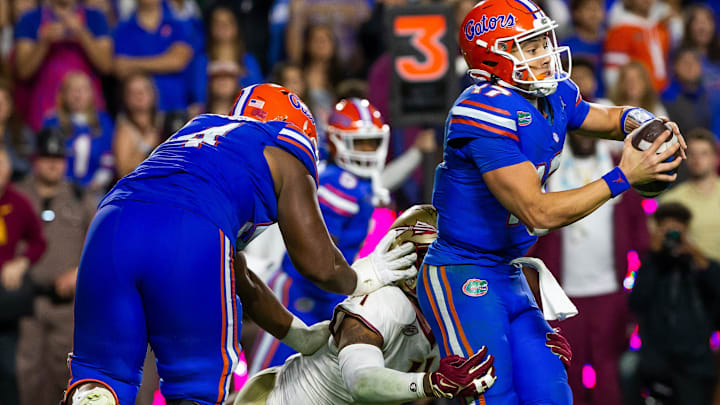 Florida State Seminoles defensive lineman Patrick Payton (11) sacks Florida Gators quarterback Max Brown (17) at Steve Spurrier Field at Ben Hill Griffin Stadium in Gainesville, FL on Saturday, November 25, 2023 during the second half. Florida State won 24-15. [Doug Engle/Gainesville Sun]