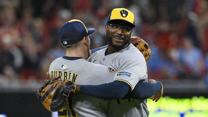 Milwaukee Brewers first baseman Andruw Monasterio celebrates with third baseman Caleb Durbin.