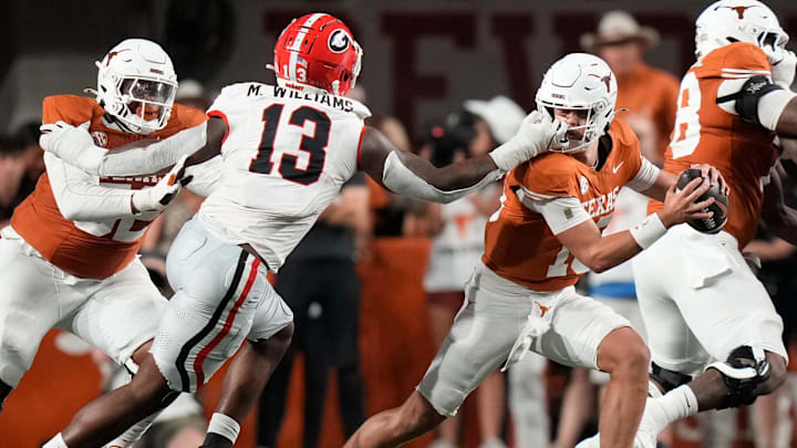 Georgia Bulldogs defensive lineman Mykel Williams face masks Texas Longhorns quarterback Arch Manning in the second quarter at Darrell K Royal-Texas Memorial Stadium Saturday October 19, 2024.