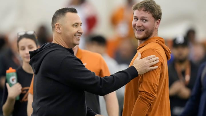 Head coach Steve Sarkisian greets quarterback Quinn Ewers who threw passes to receivers at Texas Longhorns Football Pro Day at Frank Denius Fields Wednesday March 20, 2024. Head coach Steve Sarkisian greets quarterback Quinn Ewers who threw passes to receivers at Texas Longhorns Football Pro Day at Frank Denius Fields Wednesday March 20, 2024.