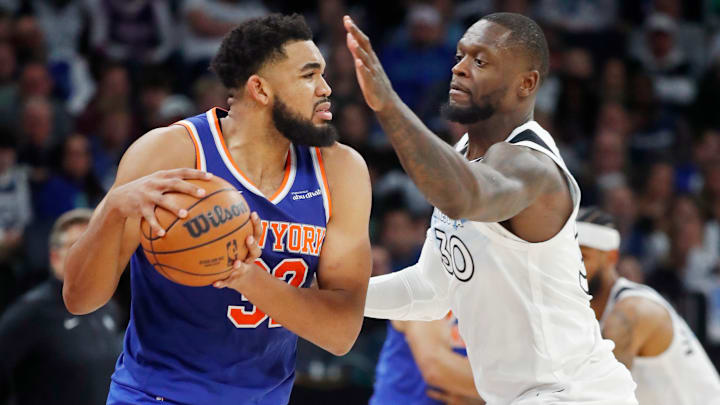 New York Knicks forward Karl-Anthony Towns, left, works around Minnesota Timberwolves forward Julius Randle in the third quarter at Target Center in Minneapolis on Dec. 19, 2024. New York Knicks forward Karl-Anthony Towns, left, works around Minnesota Timberwolves forward Julius Randle in the third quarter at Target Center in Minneapolis on Dec. 19, 2024.
