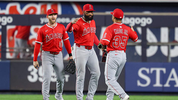 Jun 18, 2025; Bronx, New York, USA; Los Angeles Angels center fielder Jo Adell (7) and first baseman LaMonte Wade Jr. (35) and left fielder Taylor Ward (3) celebrate after defeating the New York Yankees at Yankee Stadium. Mandatory Credit: Vincent Carchietta-Imagn Images