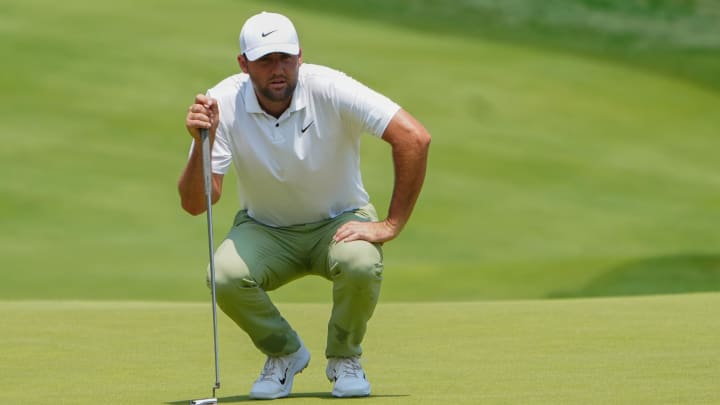 Jun 21, 2024; Cromwell, Connecticut, USA; Scottie Scheffler studies the first hole green prior to making a putt during the second round of the Travelers Championship golf tournament at TCP River Highlands. Mandatory Credit: Gregory Fisher-USA TODAY Sports