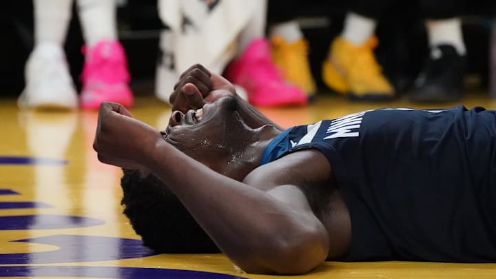 Dec 8, 2024; San Francisco, California, USA; Minnesota Timberwolves guard Anthony Edwards (5) is fouled and reacts on the ground in the second period against the Golden State Warriors at Chase Center. Mandatory Credit: David Gonzales-Imagn Images Dec 8, 2024; San Francisco, California, USA; Minnesota Timberwolves guard Anthony Edwards (5) is fouled and reacts on the ground in the second period against the Golden State Warriors at Chase Center. Mandatory Credit: David Gonzales-Imagn Images