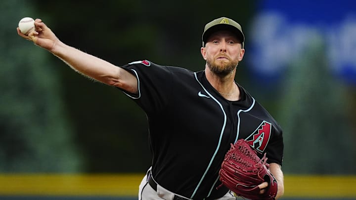 May 15, 2026; Denver, Colorado, USA; Arizona Diamondbacks starting pitcher Merrill Kelly (29) delivers a pitch in the first inning against the Colorado Rockies at Coors Field. Mandatory Credit: Ron Chenoy-Imagn Images