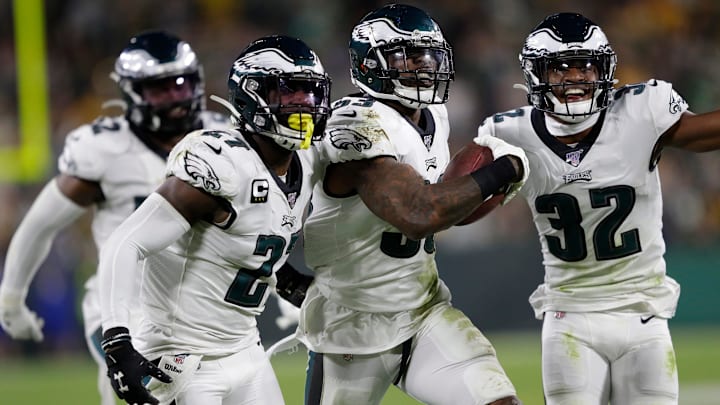 Former Philadelphia Eagles outside linebacker Nigel Bradham (53) celebrates his fourth-quarter interception with Malcolm Jenkins (27) and Rasul Douglas (32) against the Green Bay Packers at Lambeau Field in Green Bay, Wis.