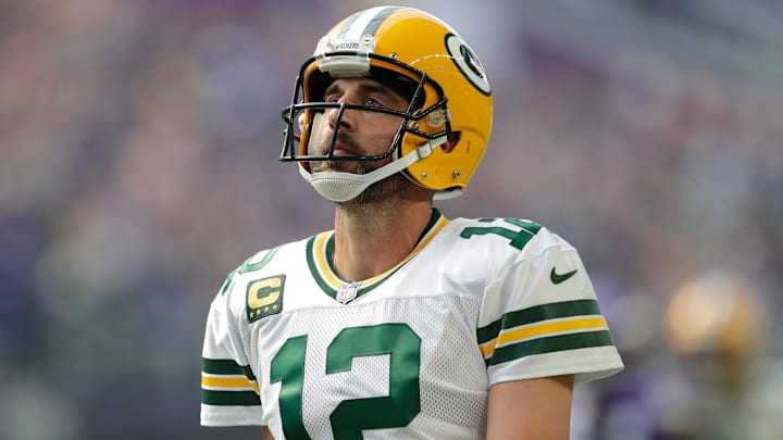 Former Green Bay Packers quarterback Aaron Rodgers (12) reacts after wide receiver Christian Watson (9) dropped a wide-open long pass at U.S. Bank Stadium.
