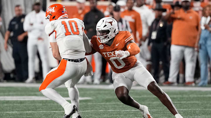 Texas Longhorns linebacker Anthony Hill Jr tackles Sam Houston Bearkats quarterback Grant Gunnell during the second half Texas Longhorns linebacker Anthony Hill Jr tackles Sam Houston Bearkats quarterback Grant Gunnell during the second half