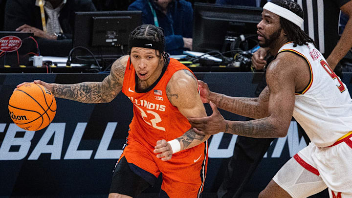 Mar 14, 2025; Indianapolis, IN, USA; Illinois Fighting Illini guard Tre White (22) dribbles the ball while Maryland Terrapins guard Selton Miguel (9) defends in the first half  at Gainbridge Fieldhouse. Mandatory Credit: Trevor Ruszkowski-Imagn Images