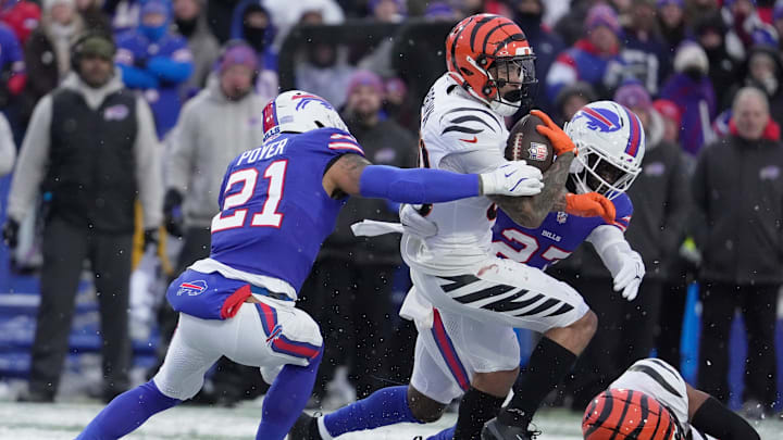 Buffalo Bills safety Jordan Poyer and cornerback Tre'Davious White move in on Cincinnati Bengals running back Chase Brown with Poyer holding onto him and bringing him down during second-half action at Highmark Stadium in Orchard Park on Dec. 7, 2025.