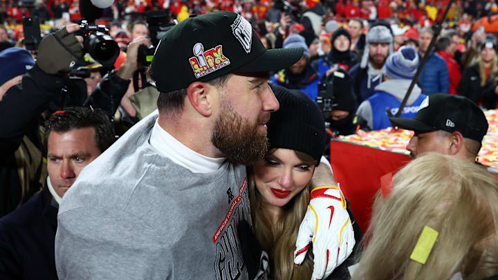 Jan 26, 2025; Kansas City, MO, USA; Recording artist Taylor Swift  and Kansas City Chiefs tight end Travis Kelce (87) react after the AFC Championship game against the Buffalo Bills at GEHA Field at Arrowhead Stadium. 