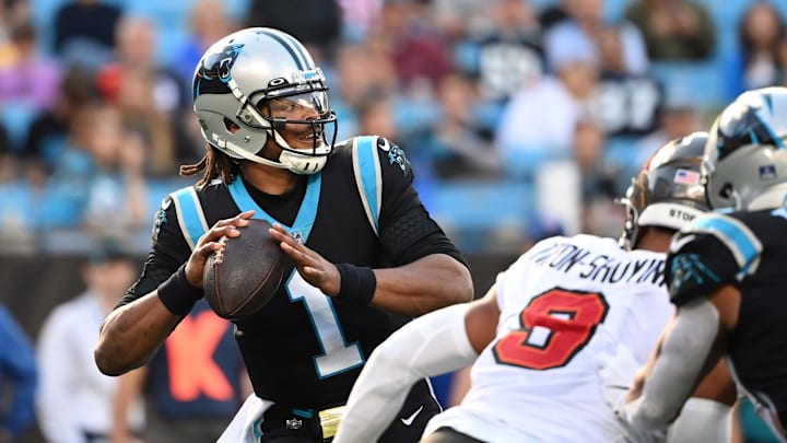 Dec 26, 2021; Charlotte, North Carolina, USA;  Carolina Panthers quarterback Cam Newton (1) looks to pass as Tampa Bay Buccaneers outside linebacker Joe Tryon-Shoyinka (9) pressures in the third quarter at Bank of America Stadium. Mandatory Credit: Bob Donnan-Imagn Images