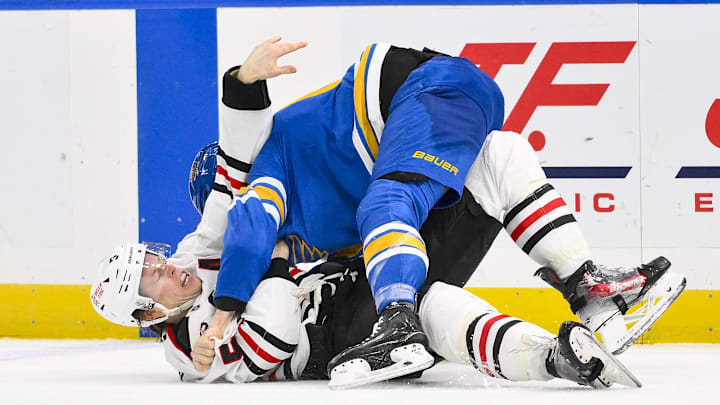 Dec 12, 2025; St. Louis, Missouri, USA; St. Louis Blues left wing Dylan Holloway (81) fights Chicago Blackhawks defenseman Connor Murphy (5) during the second period at Enterprise Center. Mandatory Credit: Jeff Curry-Imagn Images Dec 12, 2025; St. Louis, Missouri, USA; St. Louis Blues left wing Dylan Holloway (81) fights Chicago Blackhawks defenseman Connor Murphy (5) during the second period at Enterprise Center. Mandatory Credit: Jeff Curry-Imagn Images