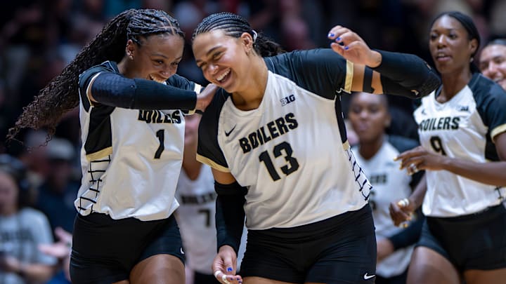 Purdue redshirt sophomore Rachel Williams (1) and Purdue senior Akasha Anderson (13) celebrate after the second set