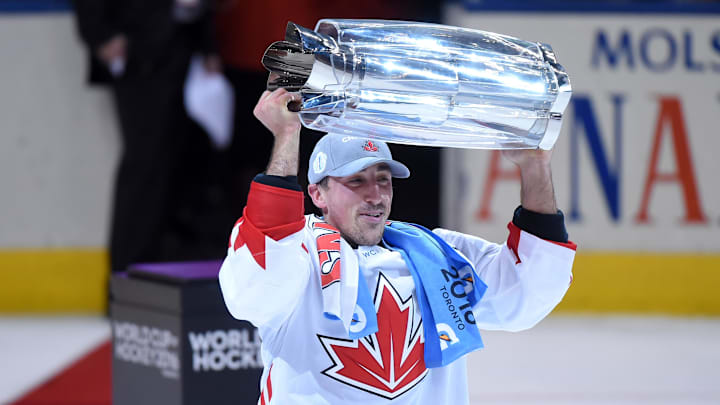 Team Canada center Brad Marchand hoists the World Cup of Hockey championship trophy.