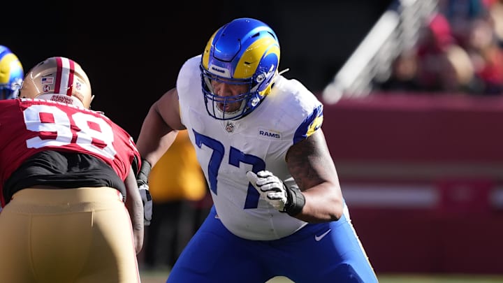 Jan 7, 2024; Santa Clara, California, USA; Los Angeles Rams offensive tackle Alaric Jackson (77) blocks San Francisco 49ers defensive tackle Javon Hargrave (98) during the first quarter at Levi's Stadium. Mandatory Credit: Darren Yamashita-Imagn Images
