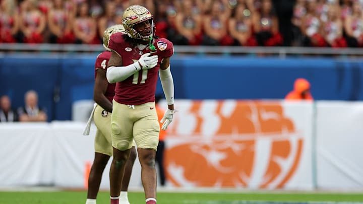 Dec 30, 2023; Miami Gardens, FL, USA; Florida State Seminoles defensive lineman Patrick Payton (11) reacts against the Georgia Bulldogs during the first half in the 2023 Orange Bowl at Hard Rock Stadium. Mandatory Credit: Nathan Ray Seebeck-Imagn Images