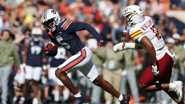 Nov 16, 2024; Auburn, Alabama, USA; Louisiana Monroe Warhawks defensive back Wydett Williams Jr. (12) chases Auburn Tigers wide receiver KeAndre Lambert-Smith (5) during the first quarter at Jordan-Hare Stadium. Mandatory Credit: John Reed-Imagn Images