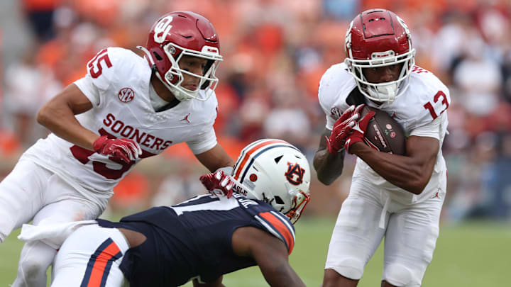 Oklahoma Sooners wide receiver J.J. Hester (13) carries during the third quarter against the Auburn Tigers at Jordan-Hare Stadium. 