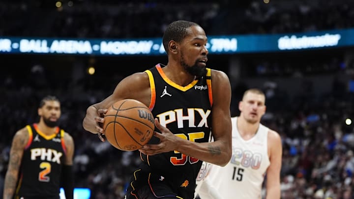 Mar 7, 2025; Denver, Colorado, USA; Phoenix Suns forward Kevin Durant (35) drives to the net in the second quarter against the Denver Nuggets at Ball Arena. Mandatory Credit: Ron Chenoy-Imagn Images