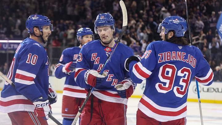 Oct 6, 2026; New York, New York, USA;  New York Rangers left wing Alexis Lafreniere (13) celebrates with his teammates after scoring a goal in the third period against the New York Islanders at Madison Square Garden.  Mandatory Credit: Wendell Cruz-Imagn Images