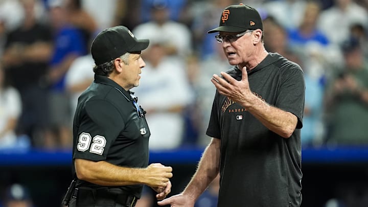 Sep 20, 2024; Kansas City, Missouri, USA; San Francisco Giants manager Bob Melvin (6) talks with umpire James Hoye (92) during the ninth inning against the Kansas City Royals at Kauffman Stadium.