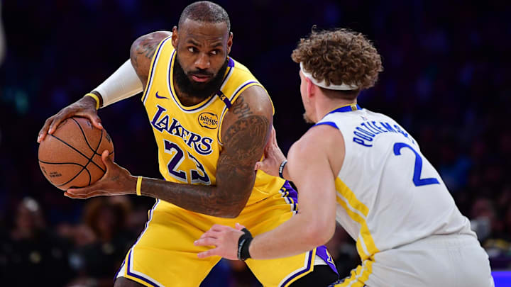 Los Angeles Lakers forward LeBron James (23) controls the ball against Golden State Warriors guard Brandin Podziemski (2) during the first half at Crypto.com Arena. Mandatory Credit: Gary A. Vasquez-Imagn Images