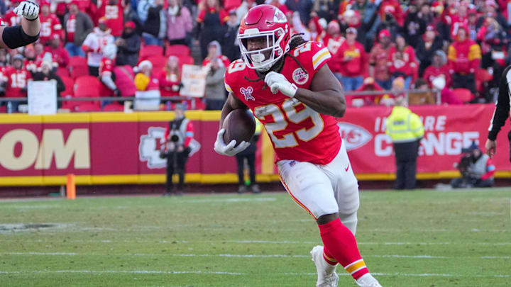 Dec 21, 2024; Kansas City, Missouri, USA; Kansas City Chiefs running back Kareem Hunt (29) runs the ball against the Houston Texans during the second half at GEHA Field at Arrowhead Stadium. Mandatory Credit: Denny Medley-Imagn Images