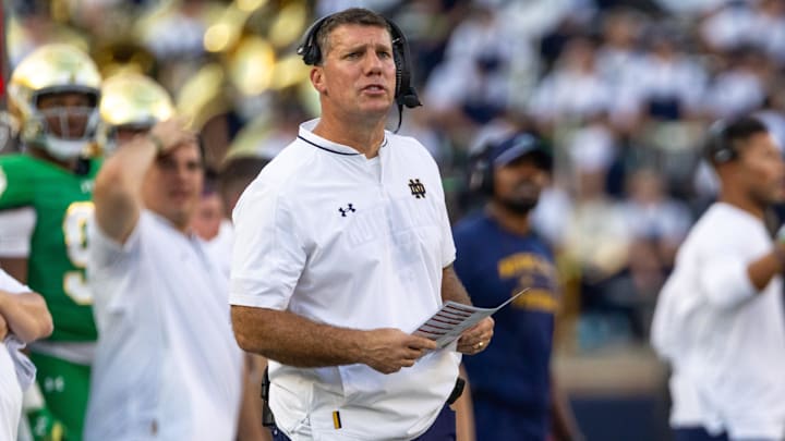 Oct 4, 2025; South Bend, Indiana, USA; Notre Dame defensive coordinator Chris Ash looks to the scoreboard against the Boise State Broncos during the second half at Notre Dame Stadium. Mandatory Credit: Michael Caterina-Imagn Images