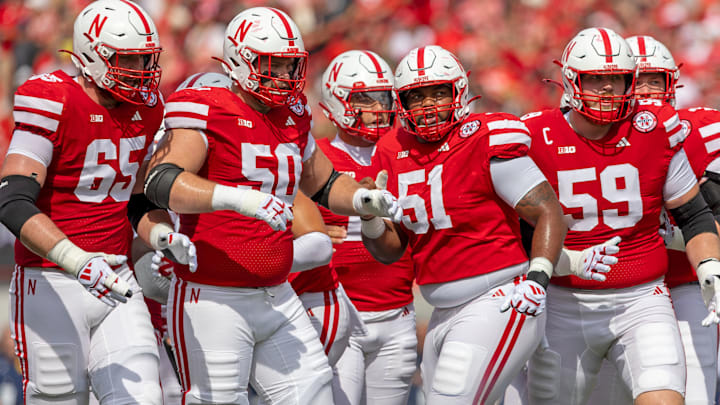 Nebraska offensive linemen, from left, Teddy Prochazka, Rocco Spindler, Justin Evans and Hentry Lutovsky get ready for a play against Michigan. Nebraska offensive linemen, from left, Teddy Prochazka, Rocco Spindler, Justin Evans and Hentry Lutovsky get ready for a play against Michigan.