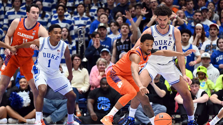 Feb 14, 2026; Durham, North Carolina, USA; Clemson Tigers guard Dillon Hunter (2) loses the ball as Duke Blue Devils forward Cameron Boozer (12) defends. Feb 14, 2026; Durham, North Carolina, USA; Clemson Tigers guard Dillon Hunter (2) loses the ball as Duke Blue Devils forward Cameron Boozer (12) defends.