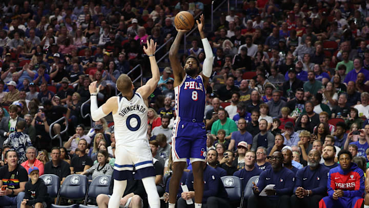 Oct 11, 2024; Des Moines, Iowa, USA; Philadelphia 76ers forward Paul George (8) shoots over Minnesota Timberwolves guard Donte DiVincenzo (0) at Wells Fargo Arena. Mandatory Credit: Reese Strickland-Imagn Images