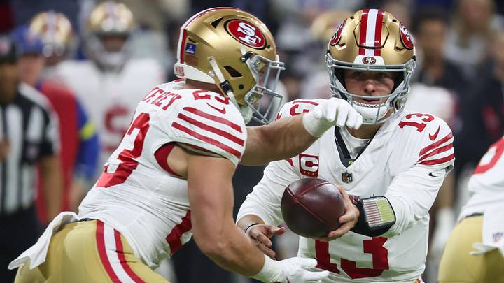 Dec 22, 2025; Indianapolis, Indiana, USA; San Francisco 49ers quarterback Brock Purdy (13) hands the ball to running back Christian McCaffrey (23) against the Indianapolis Colts in the first quarter of the game at Lucas Oil Stadium. Mandatory Credit: Trevor Ruszkowski-Imagn Images