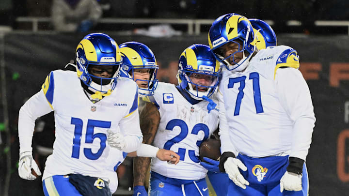 Jan 18, 2026; Chicago, IL, USA; Los Angeles Rams running back Kyren Williams (23) celebrates with wide receiver Konata Mumpfield (15), quarterback Matthew Stafford (9) and offensive tackle Warren McClendon Jr. (71) after scoring a touchdown against the Chicago Bears during the fourth quarter of an NFC Divisional Round game at Soldier Field. Mandatory Credit: Matt Marton-Imagn Images