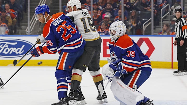 Apr 4, 2026; Edmonton, Alberta, CAN; Vegas Golden Knights forward Reilly Smith (19) tries to deflect a shot on Edmonton Oilers goaltender Connor Ingram (39) during the second period at Rogers Place. Mandatory Credit: Perry Nelson-Imagn Images
