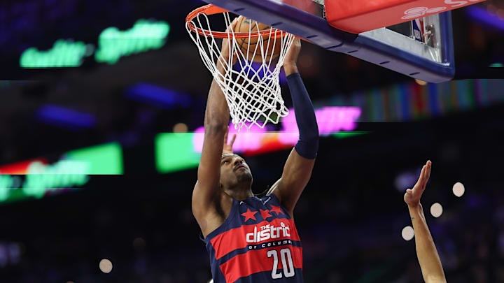 Mar 26, 2025; Philadelphia, Pennsylvania, USA; Washington Wizards forward Alex Sarr (20) dunks the ball Philadelphia 76ers during the first quarter at Wells Fargo Center.