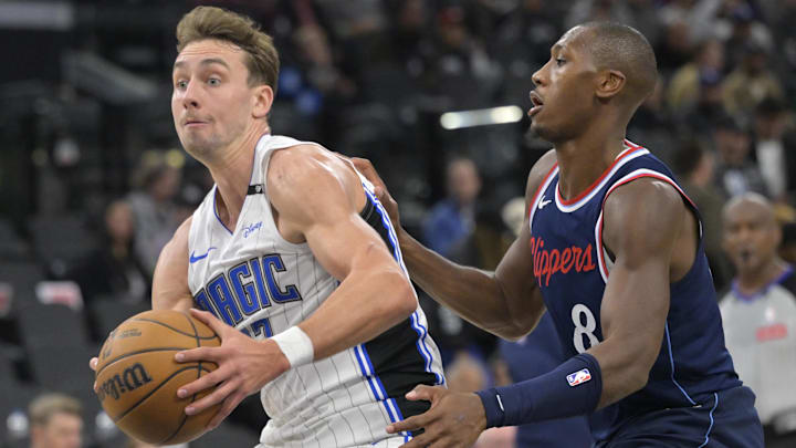 Orlando Magic forward Franz Wagner (22) drives past Los Angeles Clippers guard Kris Dunn (8) in the first half at Intuit Dome.