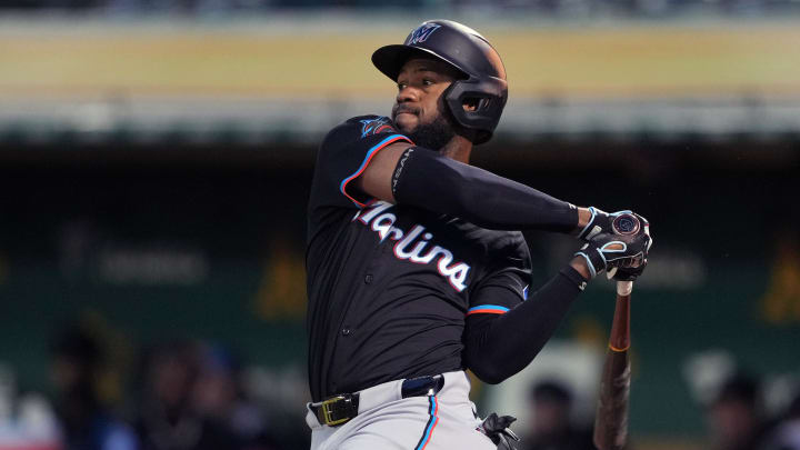 May 3, 2024; Oakland, California, USA; Miami Marlins left fielder Bryan De La Cruz (14) bats against the Oakland Athletics during the sixth inning at Oakland-Alameda County Coliseum. Mandatory Credit: Darren Yamashita-USA TODAY Sports