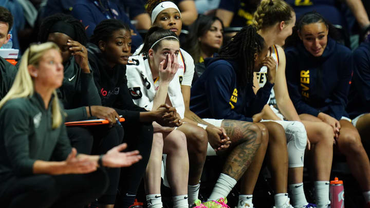 Jun 10, 2024; Uncasville, Connecticut, USA; Indiana Fever guard Caitlin Clark (22) on the bench with her teammates in the second half as they take on the Connecticut Sun at Mohegan Sun Arena. Mandatory Credit: David Butler II-USA TODAY Sports Jun 10, 2024; Uncasville, Connecticut, USA; Indiana Fever guard Caitlin Clark (22) on the bench with her teammates in the second half as they take on the Connecticut Sun at Mohegan Sun Arena. Mandatory Credit: David Butler II-USA TODAY Sports