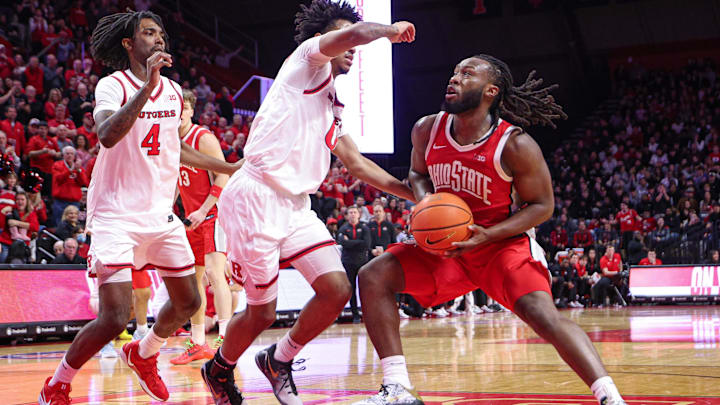 Jan 2, 2026; Piscataway, New Jersey, USA; Ohio State Buckeyes guard Bruce Thornton (2) goes to the basket as Rutgers Scarlet Knights guard Tariq Francis (0) and forward Bryce Dortch (4) defends during the first half at Jersey Mike's Arena. Mandatory Credit: Vincent Carchietta-Imagn Images