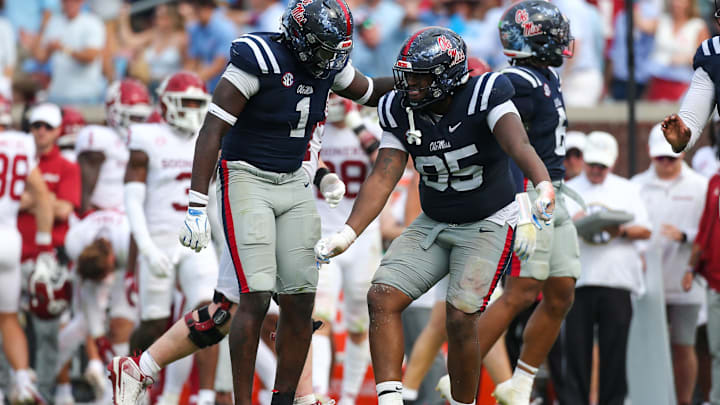 Oct 26, 2024; Oxford, Mississippi, USA; Mississippi Rebels defensive lineman Princely Umanmielen (1) and defensive lineman Akelo Stone (95) reacts after a sack during the second half  against the Oklahoma Sooners at Vaught-Hemingway Stadium. Mandatory Credit: Petre Thomas-Imagn Images