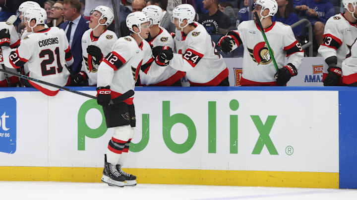 Oct 9, 2025; Tampa, Florida, USA; Ottawa Senators center Shane Pinto (12) is congratulated after he scored a goal against the Tampa Bay Lightning during the third period at Benchmark International Arena. Mandatory Credit: Kim Klement Neitzel-Imagn Images