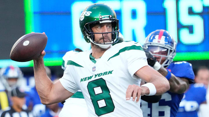 Aug 26, 2023; East Rutherford, New Jersey, USA;   New York Jets quarterback Aaron Rodgers (8) throws against the Giants at MetLife Stadium. Mandatory Credit: Robert Deutsch-Imagn Images